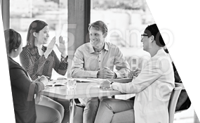 A group of people sitting around a table. Description generated by AI