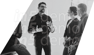 Three people in a conference room. Description generated by AI